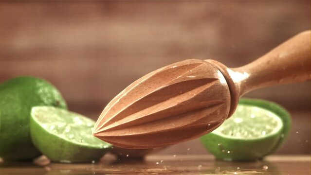 The lime squeezer falls on the wet table. Filmed on a high-speed camera at 1000 fps. High quality FullHD footage