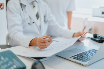 Experienced Doctors Reviewing Medical Analysis and Diagnostic Test Results