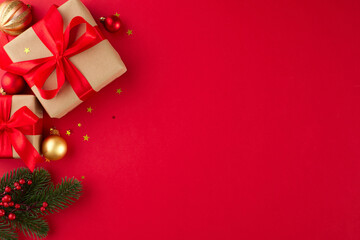 Enhance your loved ones Christmas with sincere presents. Top view shot of presents boxes, fir...