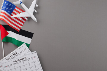 Issues in removing civilians from Gaza sector. Top view photo of American flag, Palestinian flag, calendars, airplane on grey background with empty space for special message