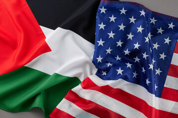 United States-Palestinian diplomacy concept. Top view photo of American flag, Palestinian flag on grey background