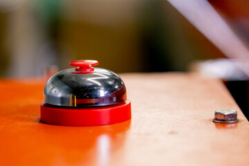 Close-up shot of a big red button to turn on and off the movement of the belt on a waste sorting...
