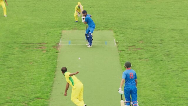 Intense Cricket Moment on Live TV Broadcast. Two Premier Indian Teams Playing a Tournament. Attacking Team Sprints to Hit the Wicket, But the Opponent Blue Team Finishes the Scoring Run Just in Time