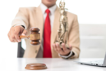 gavel wood Brass scales and a statue of Themis Lady Justice are placed on the tables of the lawyers...
