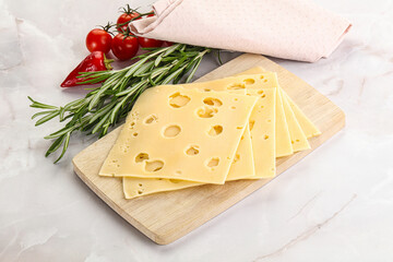 Sliced maasdam cheese with holes