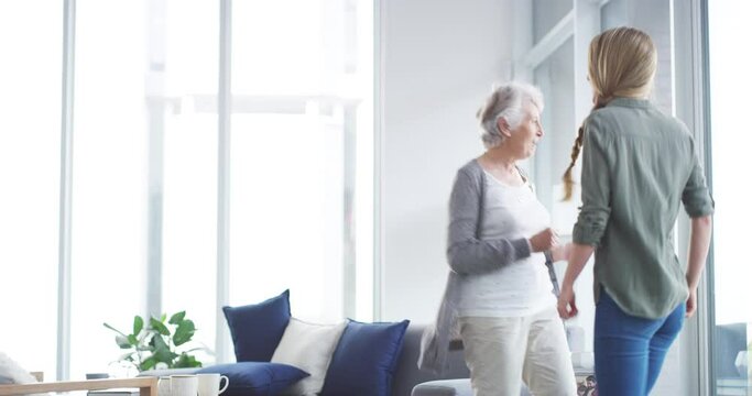 Happy, senior mother and woman in home dancing with freedom to music, radio or mockup. People, moving and smile with energy and sound in new house, living room or together in lounge of apartment