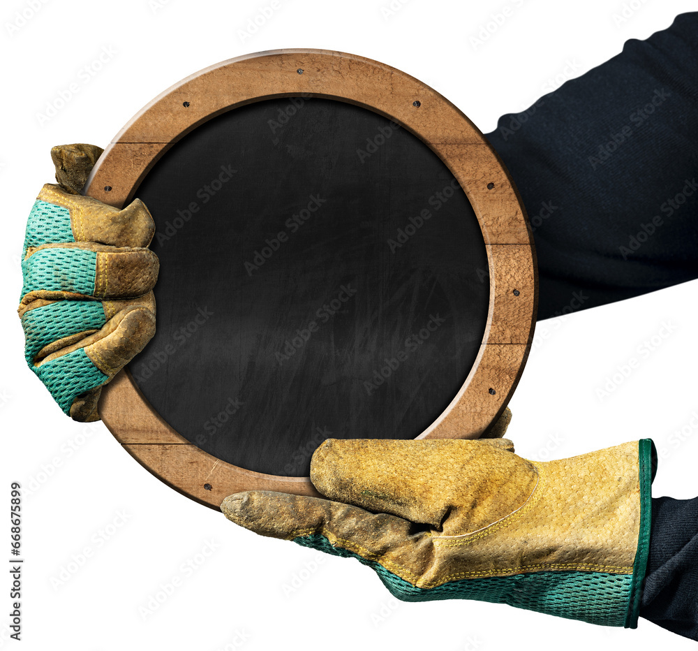 Poster hands with protective work gloves hold a blank blackboard with wooden frame and nails in the shape o