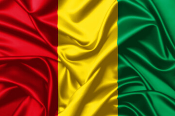 Obraz premium Guinea waving flag close up satin texture background