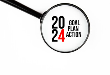 2024 goal plan action, text concept with magnifying glass. Plans, achieving the goal for 2024. Concept, motivation 2024.