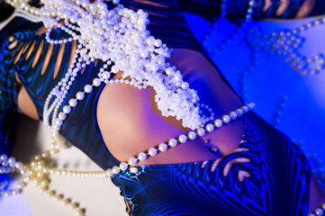 Close-up Elegance: Pearls and Oceanic Blue Pattern Lingerie