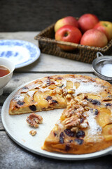 French cuisine. Matefaim. Sweet Apple Pancake with dried cranberries and walnuts for breakfast - 668700895