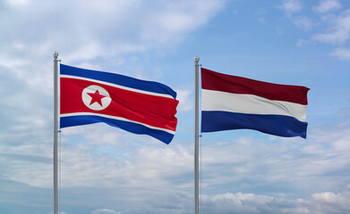 Netherlands and North Korea flags, country relationship concept