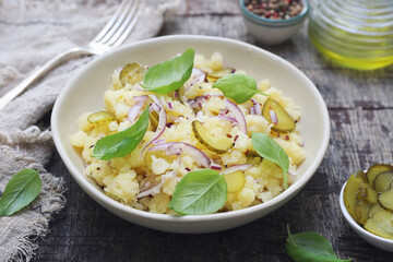 Smashed potato salad with pickles, red onion, basil and olive oil - 668701653