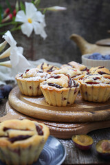 Plum muffins, cezve and cup of coffee, powdered sugar dressing - 668701689