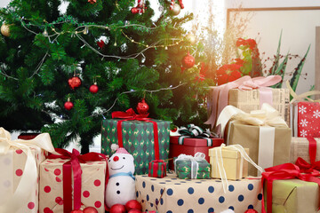 Beautiful decorative Christmas gift boxes under Christmas tree in living room, present for special time to celebrate winter holiday, celebrating and giving festival. Merry Christmas and Happy New year