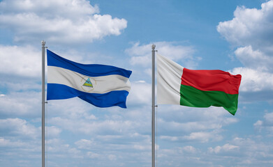 Madagascar and Nicaragua flags, country relationship concept