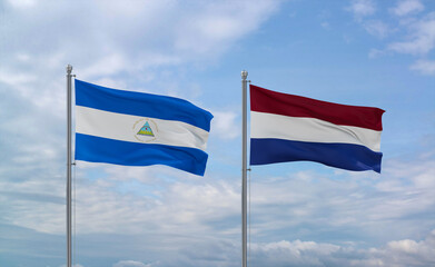 Netherlands and Nicaragua flags, country relationship concept