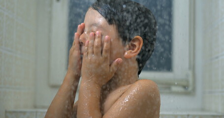 Child's Close-Up Face During Bath Water Droplets Flowing in Shower