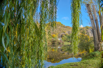 Beautiful views of the autumn river Berounka willow, forest and mountains,Czech.