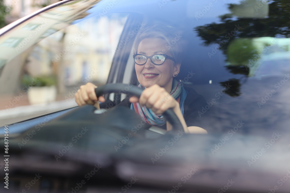 Poster Beautiful woman in car, driving with happiness on a stylish journey.