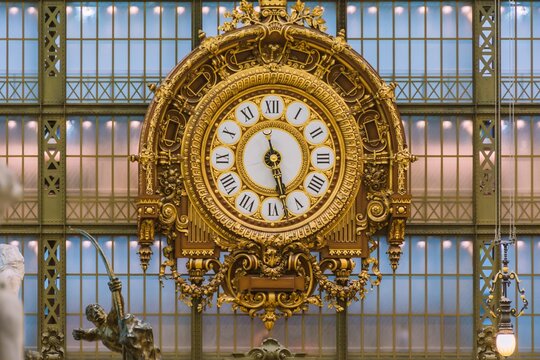 D&rsquo;Orsay Museum, Paris. Golden wooden clock from the 19th century. Interior of the Mus&eacute;e d'Orsay.