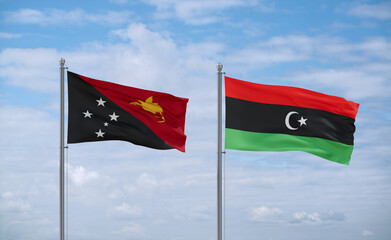 Libya and Papua New Guinea flags, country relationship concept