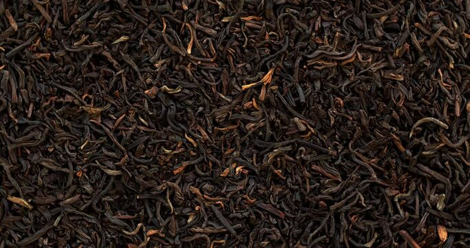 Top view of unpressed pu-erh tea background texture.  Table spin. Seamless loop.
