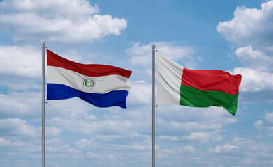 Madagascar and Paraguay flags, country relationship concept