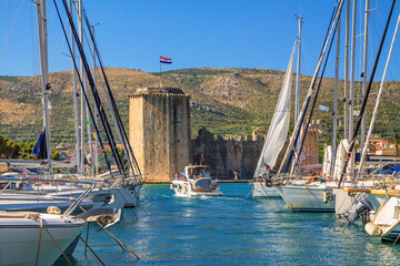 Coastal summer landscape - view of the marina and Kamerlengo Castle of the town of Trogir, the Adriatic coast of Croatia - obrazy, fototapety, plakaty