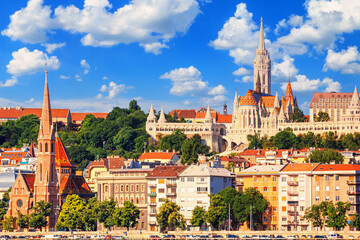 Naklejka premium City summer landscape - view of the Buda Castle, palace complex on Castle Hill with Matthias Church in Budapest, Hungary