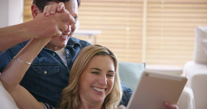 Couple, tablet and high five on sofa with credit card and excited, support and happy for online shopping. People, face and success with promotion or discount with banking, finance or deal on couch