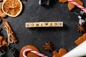 christmas, food cooking and winter holidays concept - close up of homemade gingerbread cookies,...