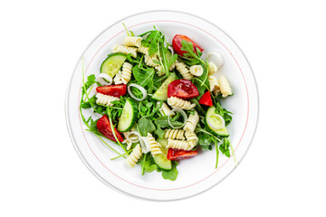 pasta salad fusilli pasta, cucumber, tomato, green lettuce, onion eating appetizer meal food snack on the table copy space food background rustic top view