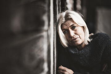 Older woman portrait in partial toning, sad depressed lost in thought empty!. - obrazy, fototapety, plakaty