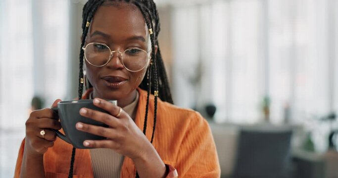 Laptop, cup of coffee and black woman in the living room of her modern apartment in the morning. Remote work, mug and young African female person drinking caffeine or latte in her home on weekend.