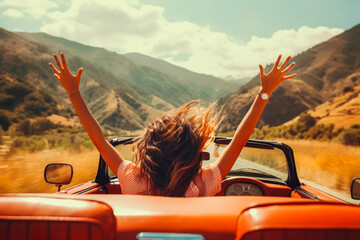 Two girls in red car driving with their hands up. Freedom concept and traveling escape.