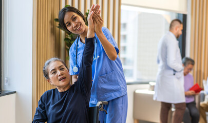 Portrait of asian woman physiotherapist carer help physical discussing consulting talk with senior...