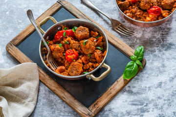 Meatballs in a tomato and lentil sauce