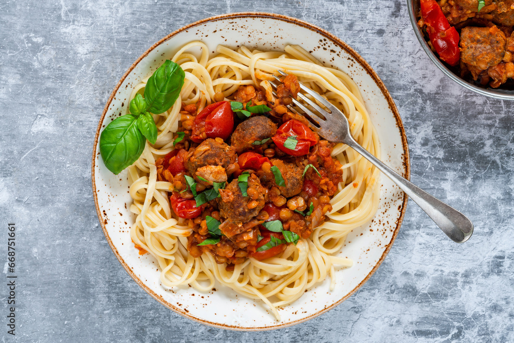 Sticker Meatballs in a tomato and lentil sauce with linguine pasta