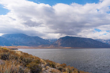 Views while hiking to Crowley Lake. Lots of clouds with a blue sky and autumn leaf colors.