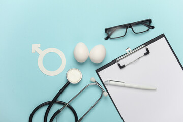 Blue ribbon symbolizing support of men and stethoscope, clipboard, eggs. Blue november prostate...