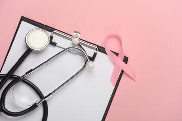 Pink ribbon, breast cancer awareness symbol with clipboard and stethoscope. Diagnostics of women's...