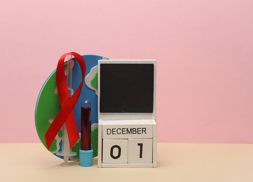 Red awareness ribbon and calendar with date december 01, blood test tube on pink background. Worlds HIV Aids Day - Powered by Adobe