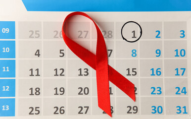 Red awareness ribbon and calendar with date december 01. Worlds HIV Aids Day
