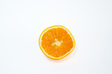 Cut open orange with white background.