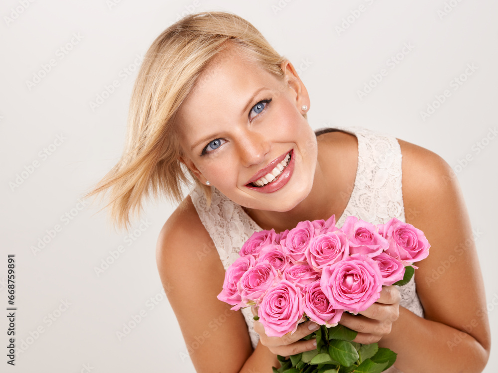 Wall mural Flowers, wedding and smile with woman in studio for floral, valentines day and romance. Bouquet, gift and happy with female person and pink roses on white background for elegant, love and present