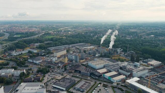 Ghent, Belgium. Factory with chimneys and clouds of smoke in the suburbs of Ghent. River Esco (Scheldt), Aerial View, Point of interest