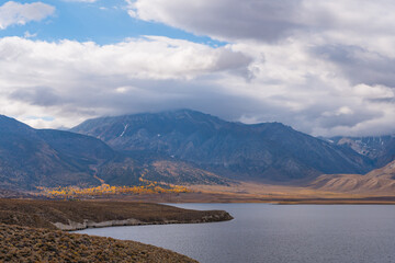 Views while hiking to Crowley Lake. Lots of clouds with a blue sky and autumn leaf colors.