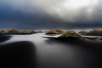 fog over the black beach