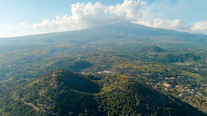 Nicolosi, Sicily, Italy. Volcanic craters overgrown with forest on the slopes of Mount Etna, Aerial View